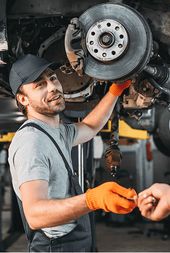 Mechanic servicing a vehicle